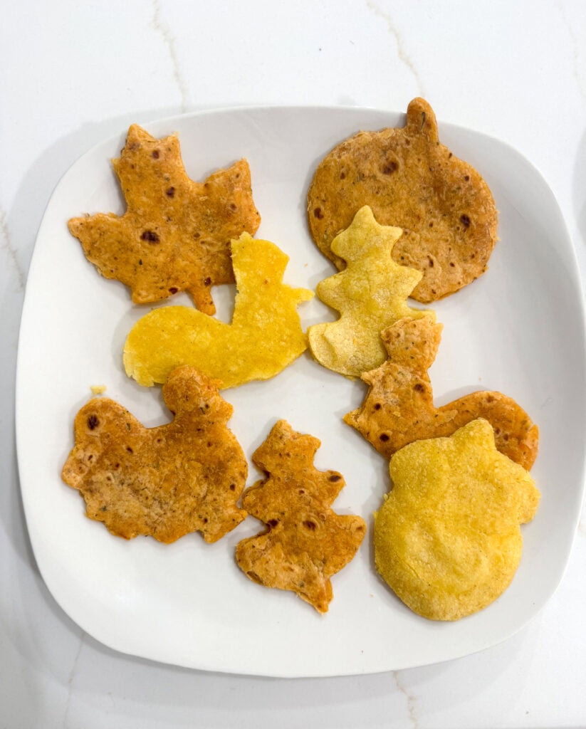 Crunchy savory quesadilla shaped like autumn leaves and pumpkins, perfect for snacks or party appetizers, featuring homemade, gluten-free, and vegan options from A Hundred Affections.