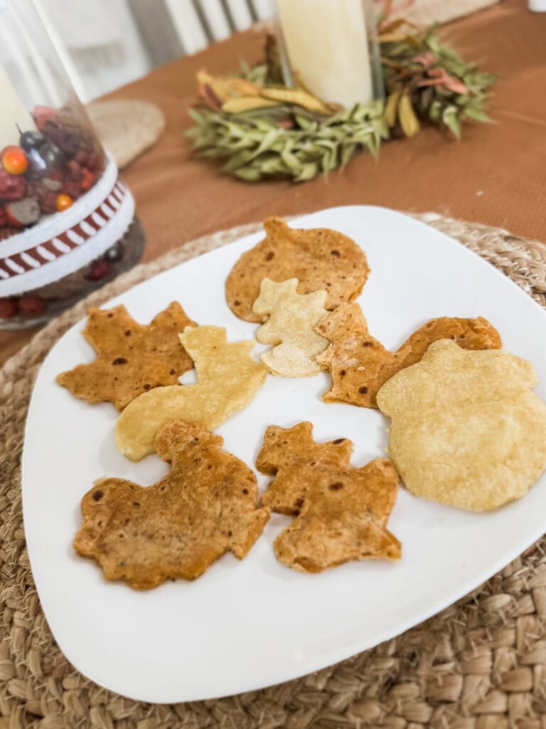 Thin sliced homemade seasoned quesadillas on a white plate, crispy and golden, perfect snack for loved ones.