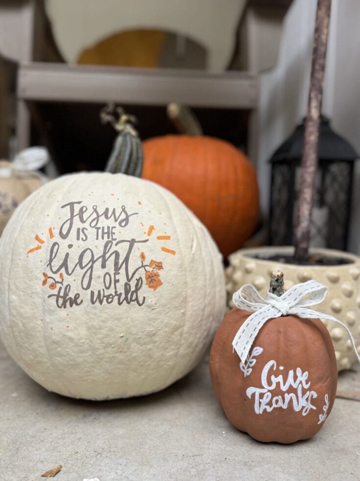 Hand-painted fall pumpkins with inspirational and gratitude messages for autumn decor.