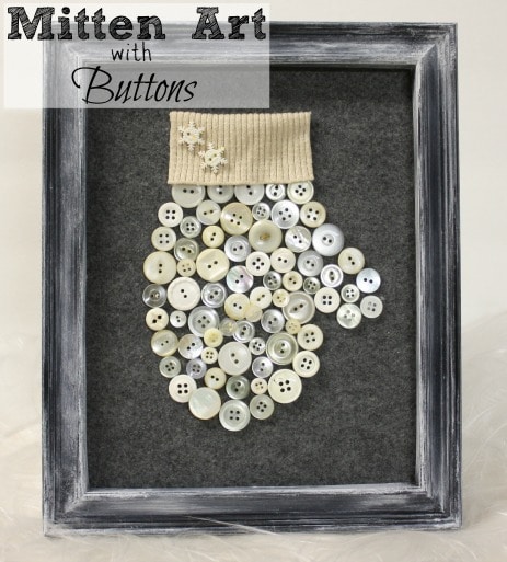 A Hundred Affections homemade art display featuring a button mitten with decorative snowflakes and a knitted cuff, showcasing creative craft ideas with buttons.