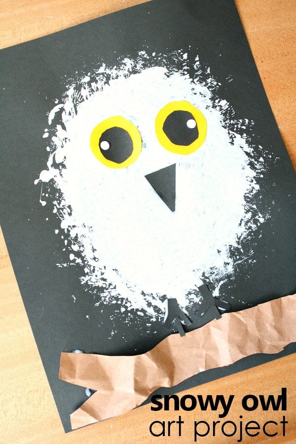 Adorable snow owl craft for kids featuring a cute, fluffy white owl with big yellow eyes and a paper beak, perfect for winter art projects and classroom activities.