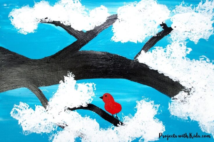 Bright red bird perched on a tree branch painted with vibrant blue and white clouds, perfect for children’s art projects and nature-inspired crafts.