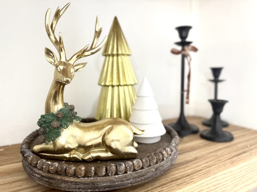 Golden reindeer and holiday décor Christmas figurine, festive holiday home decoration, seasonal Christmas décor, decorative winter holiday ornament, holiday table centerpiece.