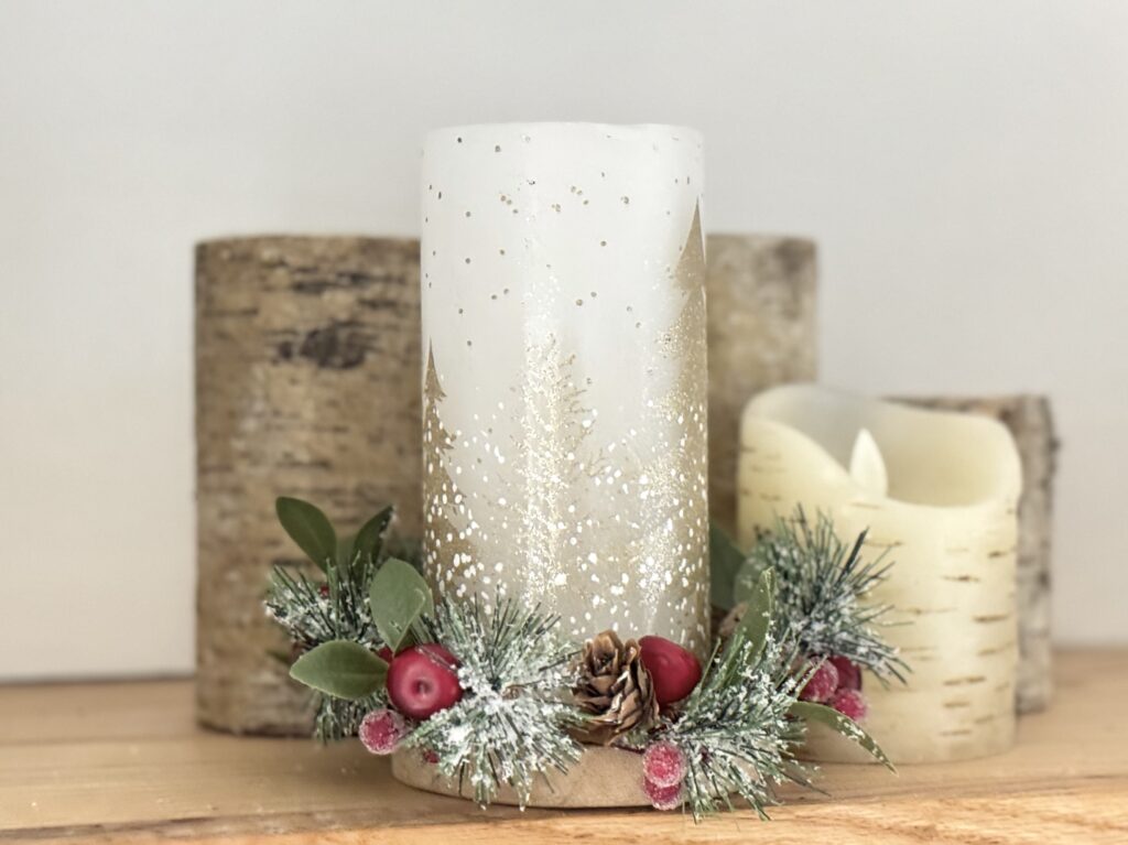 White and gold Christmas candles with festive greenery and berries, rustic wooden bases, perfect for holiday home decor and creating a cozy seasonal atmosphere.