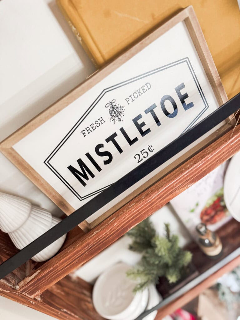Fresh picked mistletoe sign in rustic wood frame for holiday decor, Christmas seasonal decoration, festive greenery, and romantic holiday ambiance.