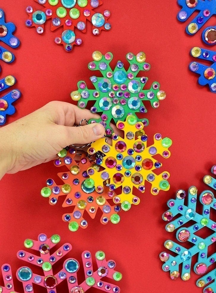Sparkling rhinestone snowflakes for holiday decorations, craft projects, and accessories. Vibrant and dazzling, perfect for adding sparkle to your Christmas decor and creative designs.