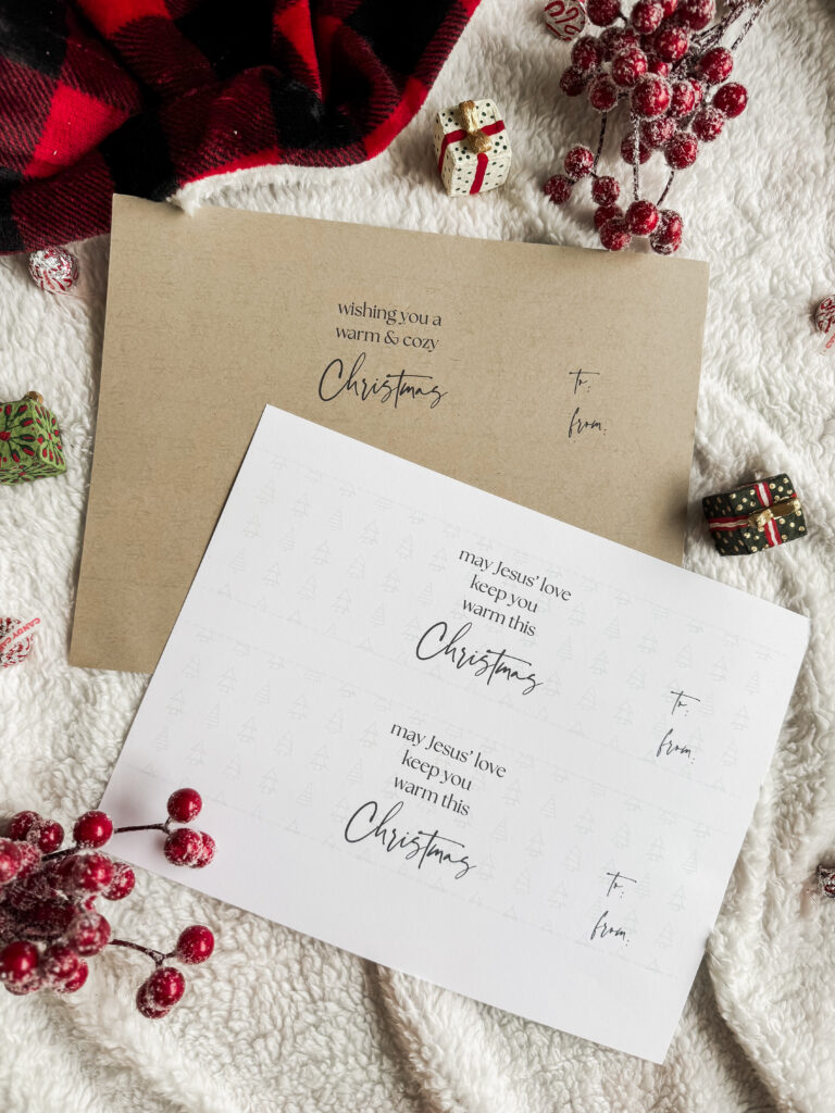A holiday Christmas card featuring a heartfelt message, holiday-themed design, and elegant typography, set among Christmas decorations and cozy textiles.