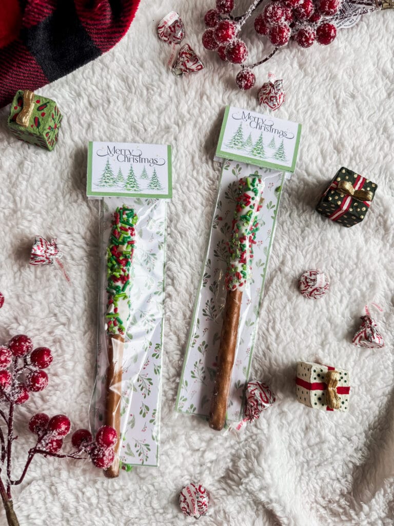 Delicious holiday-themed candy canes decorated with colorful sprinkles, perfect for Christmas celebrations.
