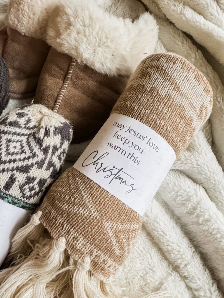 Soft, warm Christmas-themed blanket featuring a heartfelt message: "May Jesus' love keep you warm this Christmas," perfect for holiday gifting and home decor.