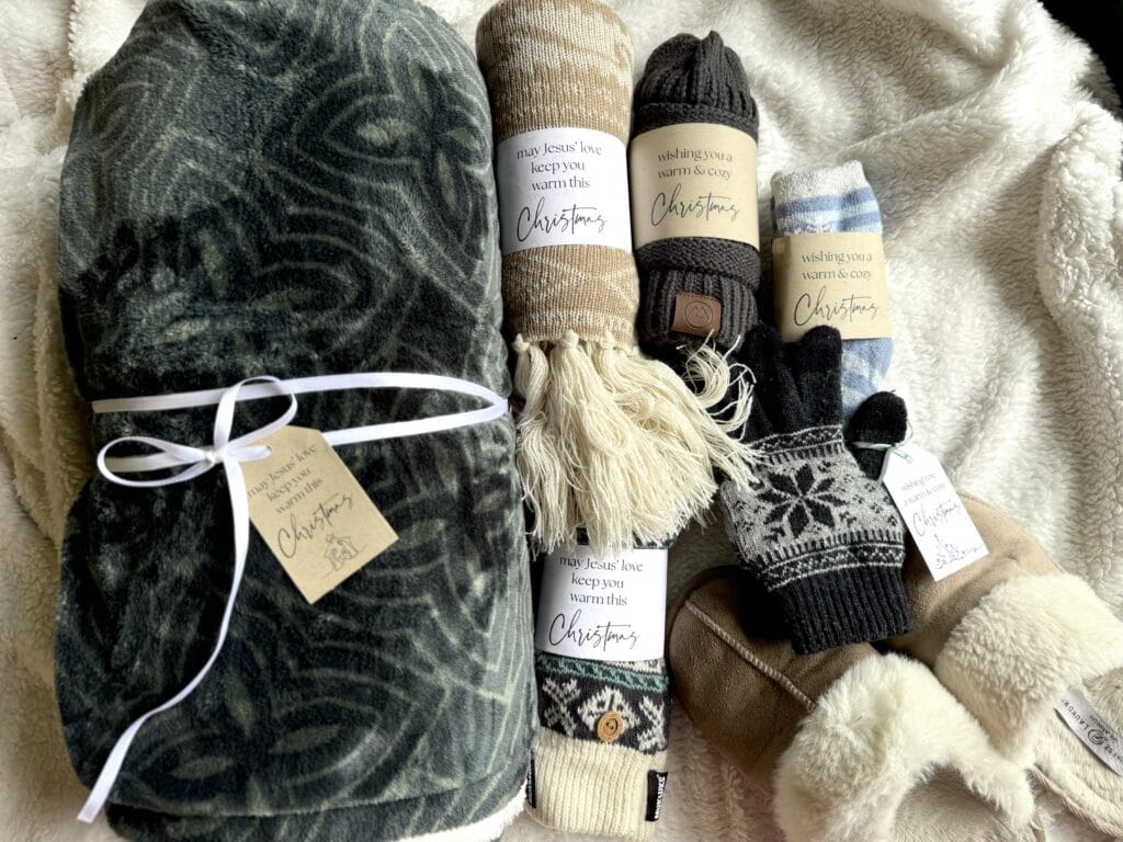 Soft, warm holiday blanket with matching Christmas socks for festive winter comfort.