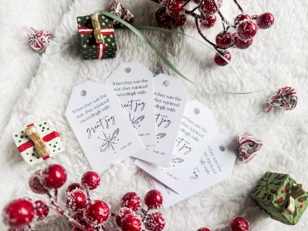 Christmas gift tags with biblical message, holiday decor, and festive wrapping paper, perfect for inspiring joy and faith during the holiday season.