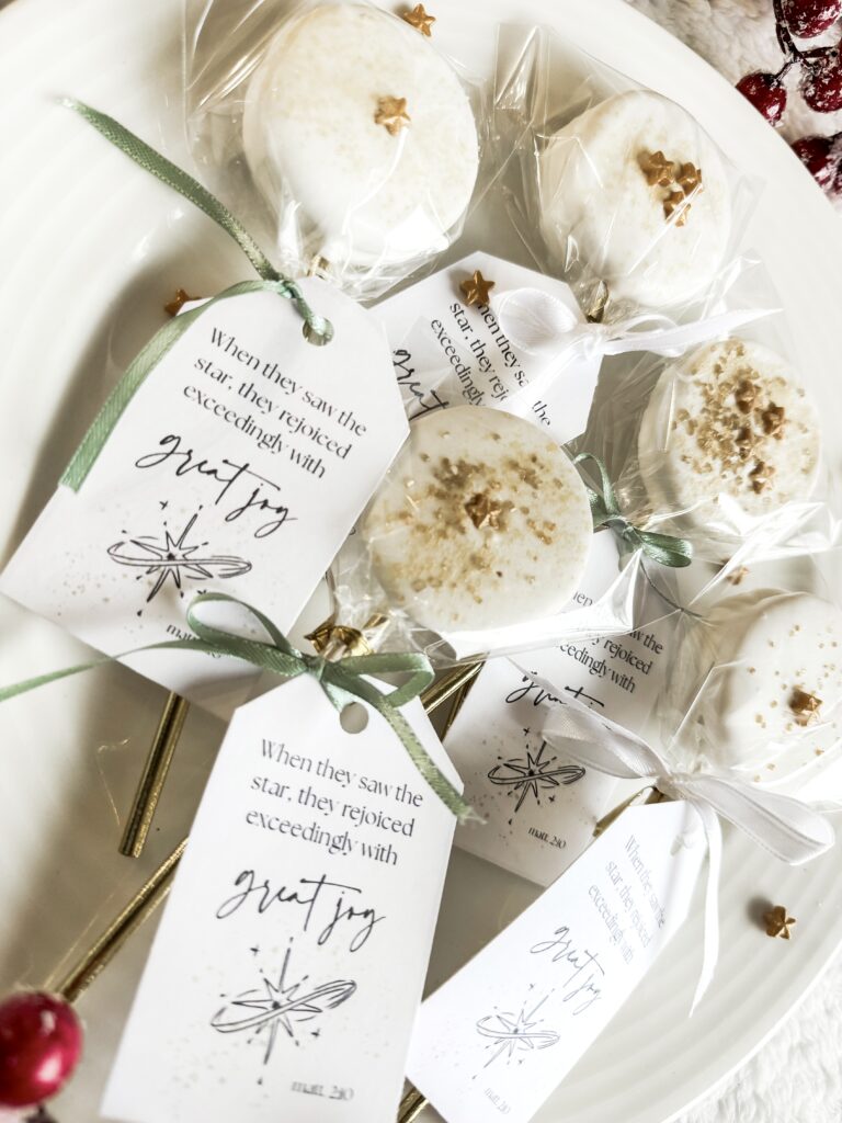 Delicious white cookies with gold star decorations and inspiring tags for Christmas gifts or holiday celebrations.