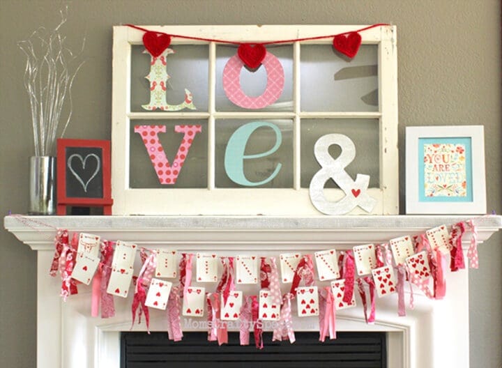 Heart themed Valentine's Day decor with banners and framed art, perfect for romantic celebrations and home decoration.