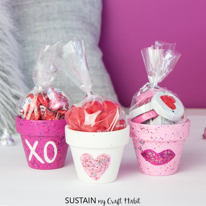 Colorful gift potted with candies and plush toys, perfect for Valentine's Day, with heart and love-themed decorations, ideal for expressing affection and love.
