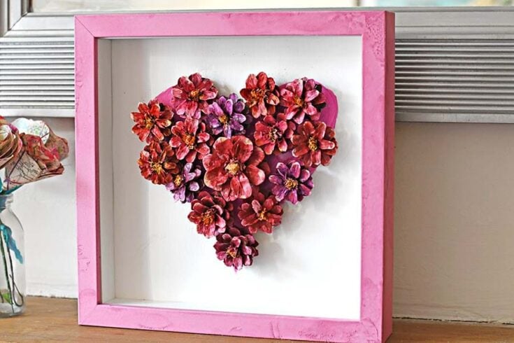 Handmade flower heart art for home decor, perfect for romantic gift or wall display, featuring vibrant pink and purple blooms in a pink frame.