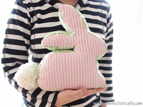 Adorable pink striped bunny stuffed animal with a fluffy tail, perfect for kids' toys or home decor, from A Hundred Affections. Soft, cute, and charming for all ages.