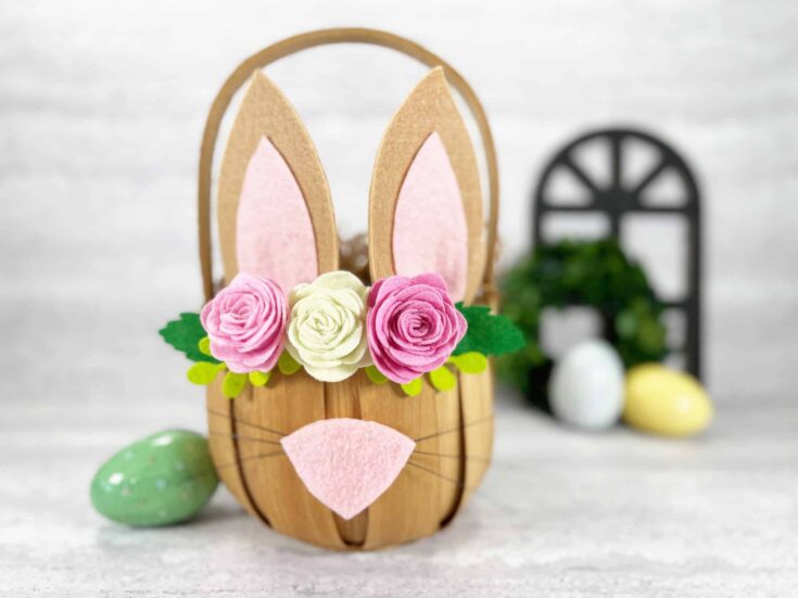 Cute Easter bunny DIY with felt flowers, decorated eggs, and miniature garden scene for festive spring celebration.