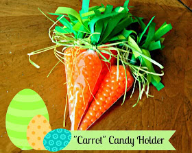 Colorful carrot-shaped candy holder with green paper grass and decorative ribbons, perfect for Easter or spring celebrations. Unique gift idea for festive occasions.