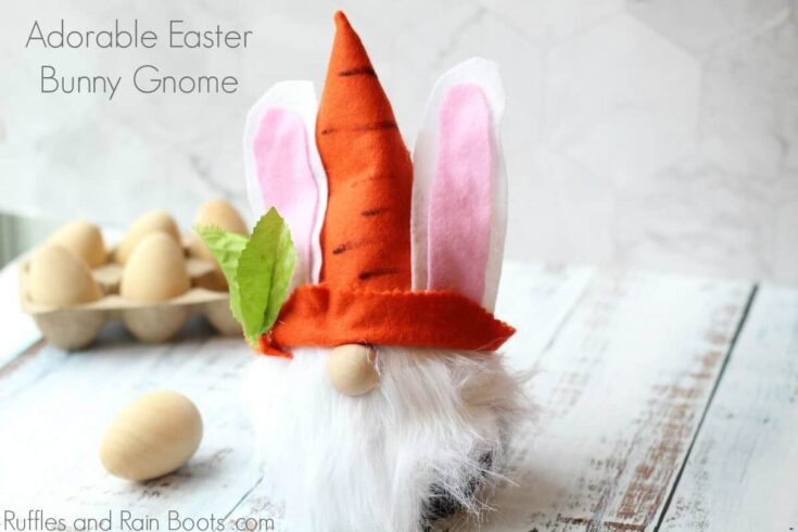Adorable handmade Easter bunny gnome with carrot hat, pink felt ears, and fluffy white beard perfect for spring decorations and holiday cheer.
