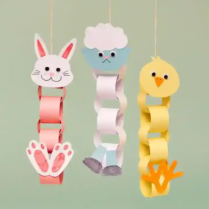 Colorful paper animal decorations featuring a bunny, sheep, and chick, perfect for kids' room decor and DIY craft projects. Bright, playful, and handmade for nursery decor.