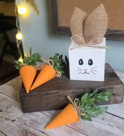 Cute carrot and bunny table decorations with greenery, perfect for spring and Easter celebrations. Handcrafted natural accents from A Hundred Affections.