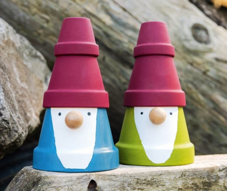 Colorful ceramic gnome decorations with red hats, whimsical garden décor, perfect for outdoor and indoor spaces, cute gift idea.
