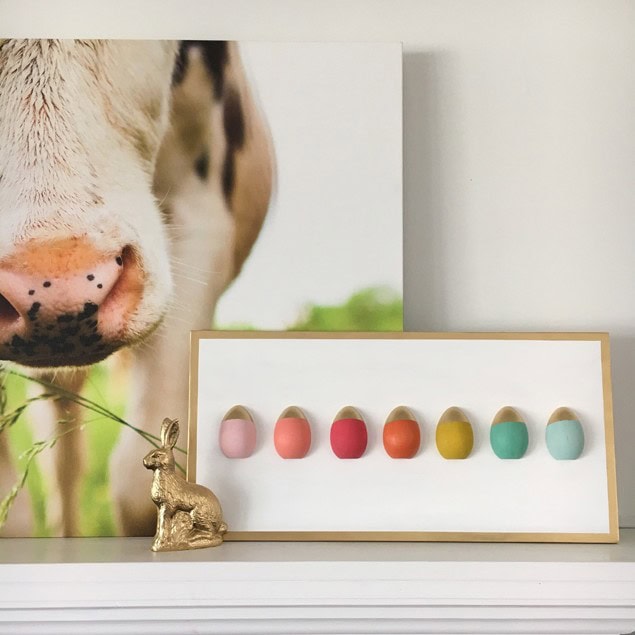 A stylish display of pastel and vibrant nail polish colors arranged in a row, perfect for inspiration on nail art and beauty trends, with a decorative bunny figure enhancing the aesthetic.
