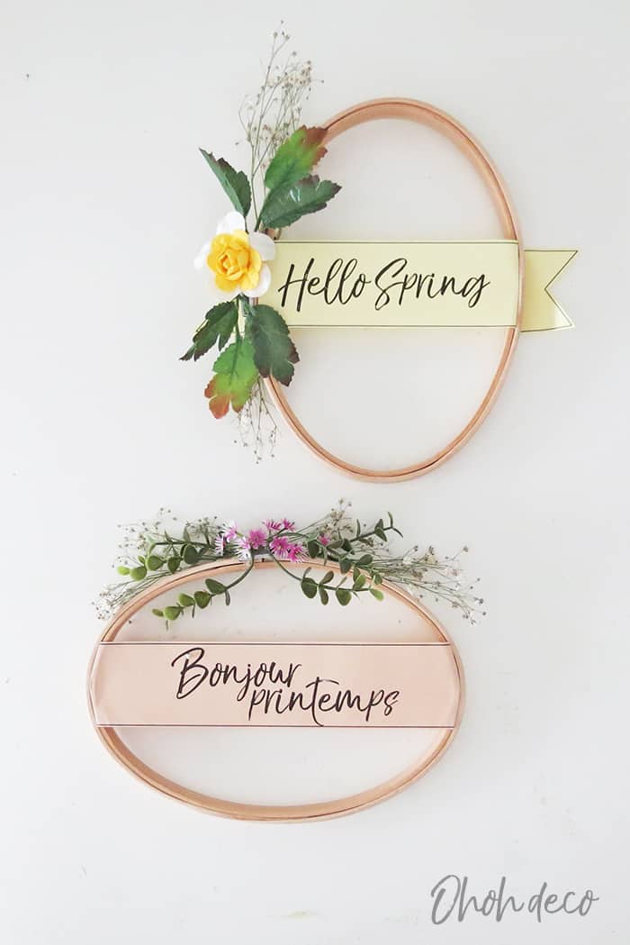 Beautiful floral hoop wreaths with "Hello Spring" and "Bonjour Printemps" messages, perfect for spring home decor, wedding decoration, or festive wreaths. Handcrafted floral accents enhance seasonal charm.