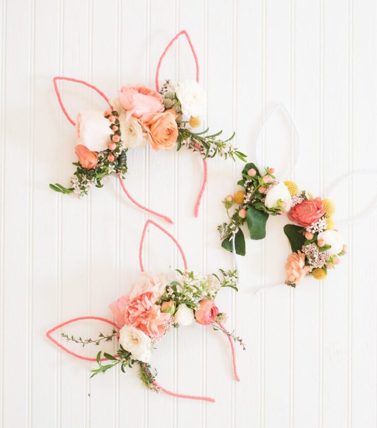 Colorful floral bunny wall art with pink and white roses, greenery, and whimsical wire frame, perfect for spring or Easter decorations.