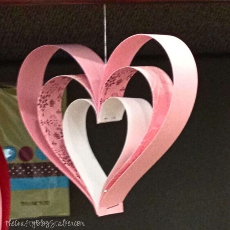 Colorful paper hearts wall decor for love-themed celebrations and home decoration.