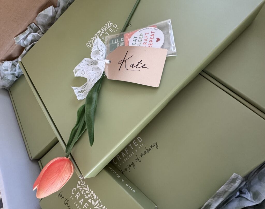 Elegant gift box with a pink flower, personalized "Kate" note, and handcrafted details for special occasions.
