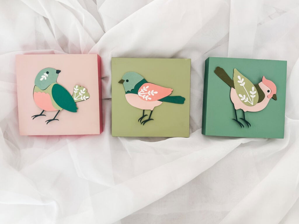 A Hundred Affections bird-themed decorative boxes with colorful layered paper designs for home decor and gifts.