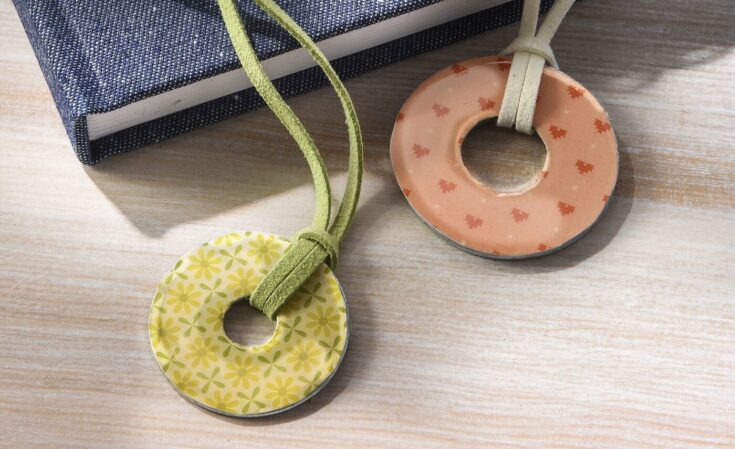 Colorful fabric donut necklaces with floral and star designs, perfect for boho jewelry lovers and unique accessories from A Hundred Affections.