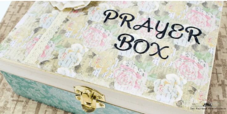A beautifully designed prayer box with floral patterns and a gold latch, perfect for storing prayers or keepsakes in a home setting.