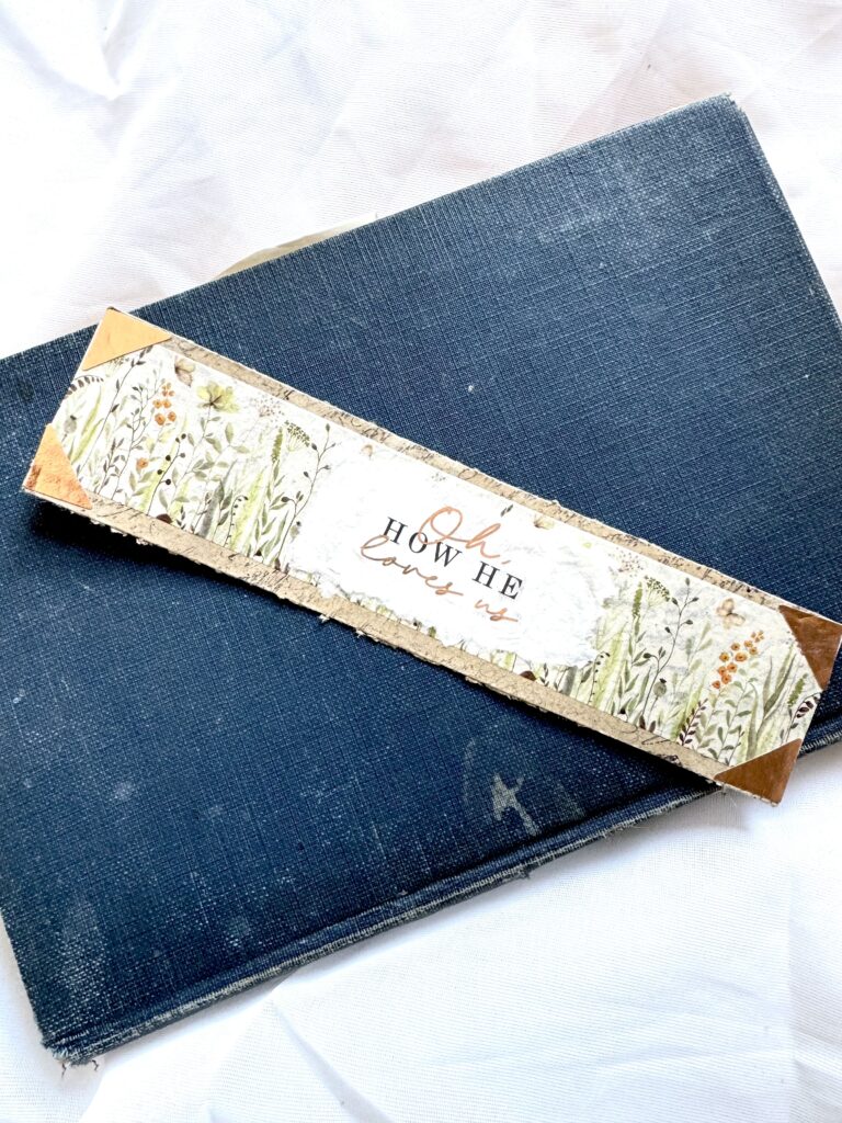 A decorative set of a hardcover blue book and a floral-patterned box with the words "How We Love" on a white background, ideal for home decor or gift purposes.