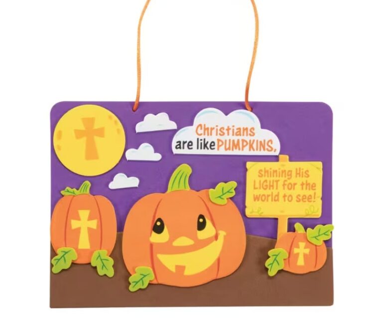 Colorful Christian-themed pumpkin craft with a smiling pumpkin, smaller pumpkins, clouds, and a sun, featuring a message about Christians shining light for the world.