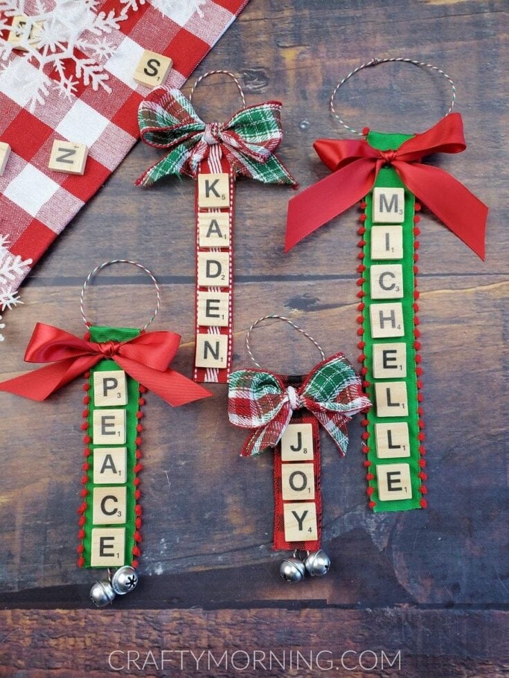 Set of four Christmas-themed hanging ornaments with personalized names and messages, decorated with bows, bells, and holiday colors on a rustic wooden background.