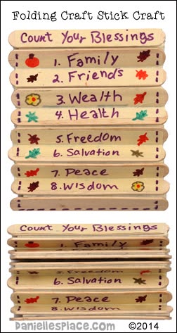 Colorful craft stick display with handwritten blessings including family, friends, health, and peace, emphasizing gratitude and positivity.