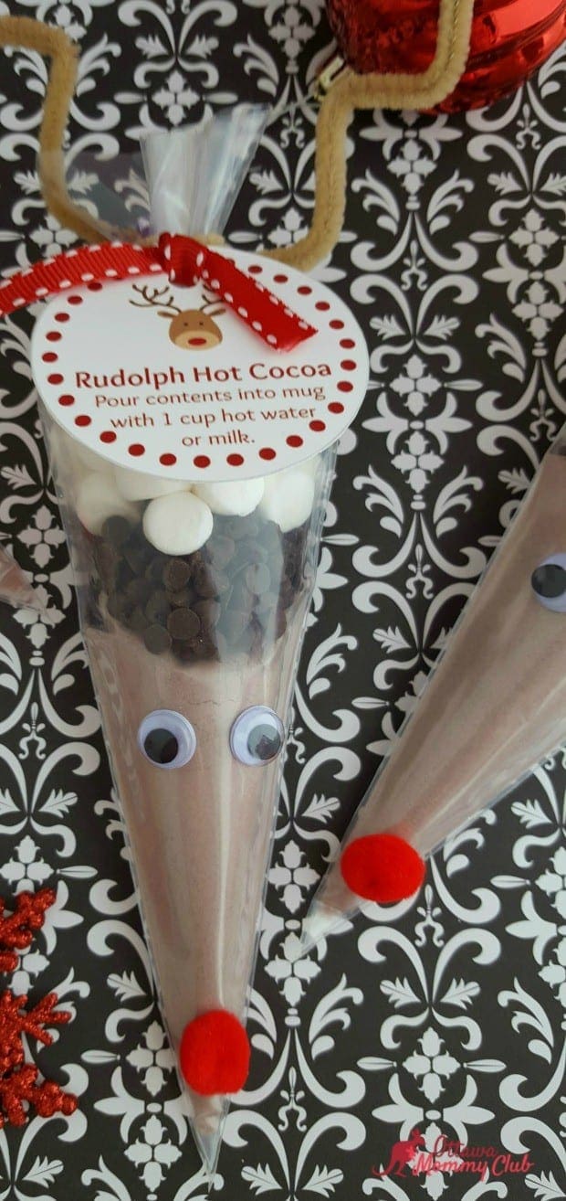 Festive Rudolph-themed hot cocoa gift bag with googly eyes and red pom-pom nose, perfect for holiday celebrations and Christmas decor.
