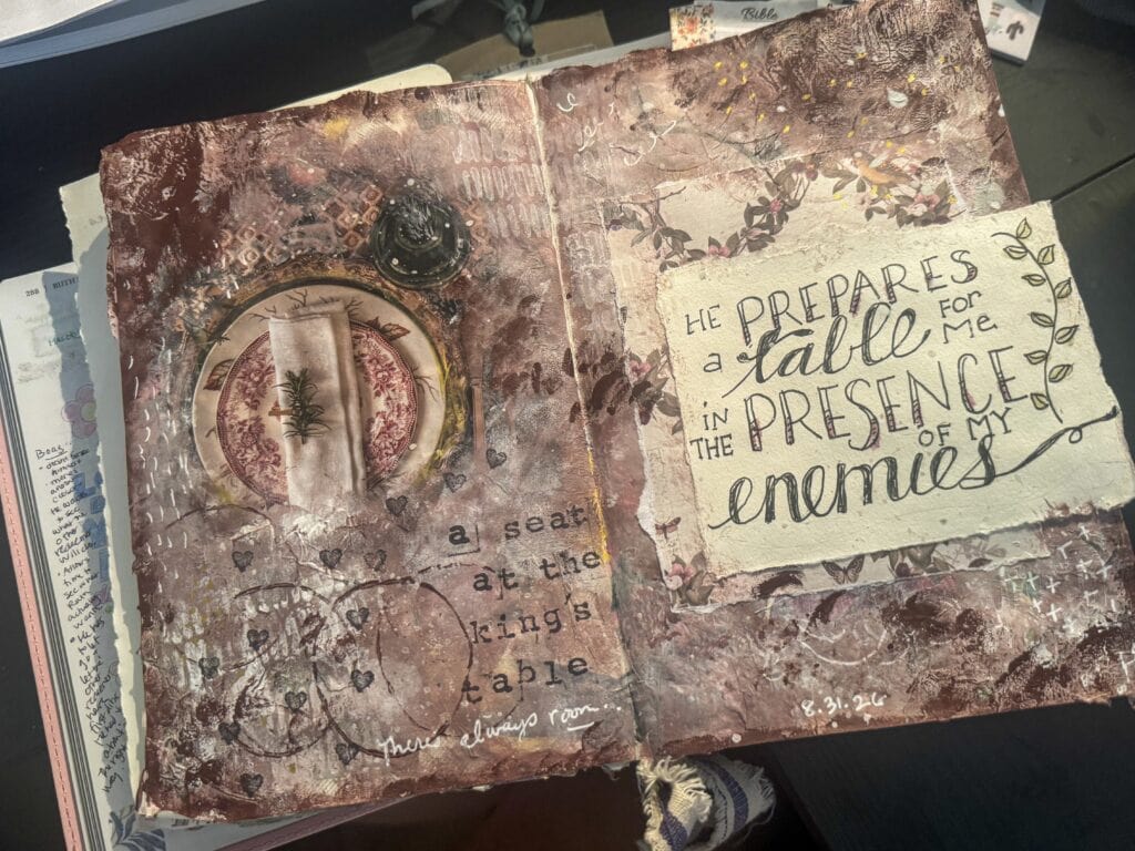 Close-up of a mixed media Bible journaling page with textured background, handwritten quote, and decorative elements, emphasizing faith and spirituality.