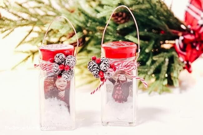 Festive Christmas jar ornaments decorated with berries and ribbons, perfect for holiday decor or gifts for grandma, from A Hundred Affections.