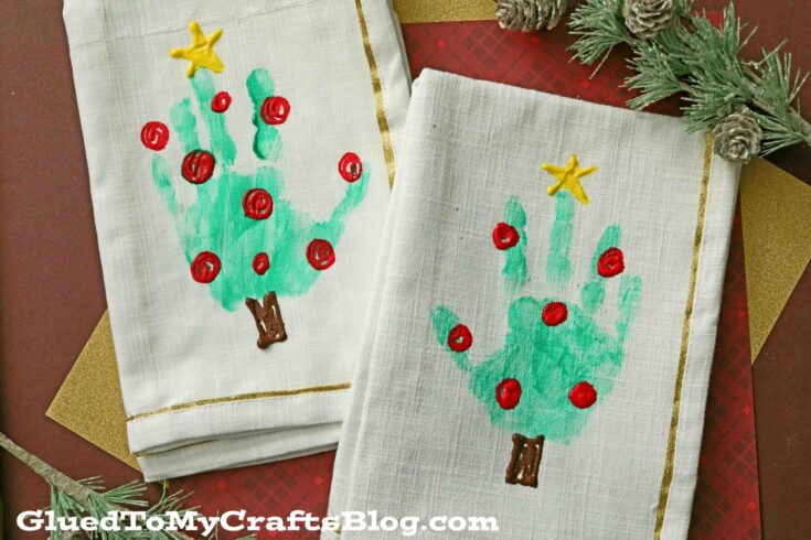 Decorative hand towels featuring a hand-painted Christmas cactus with red ornaments and a yellow star on top, perfect for holiday decor.