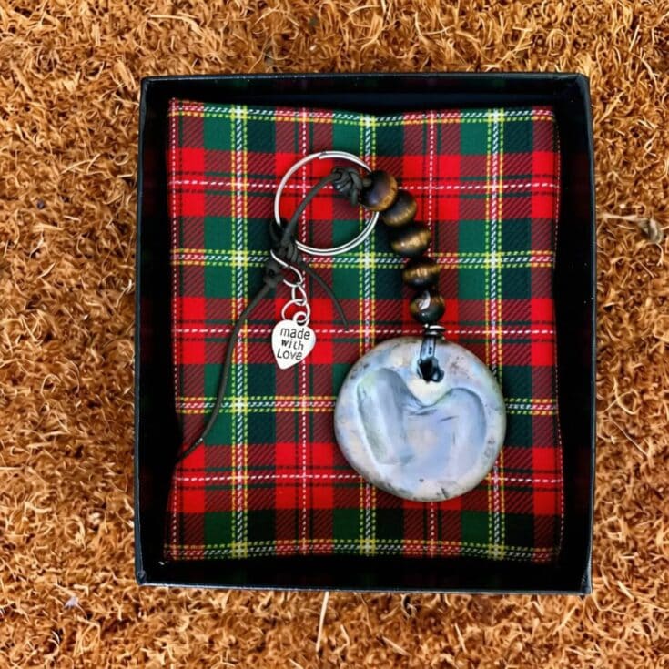 Custom handmade keychain with a shell pendant, beads, and a 'made with love' charm, perfect for a Christmas gift from kids to parents.