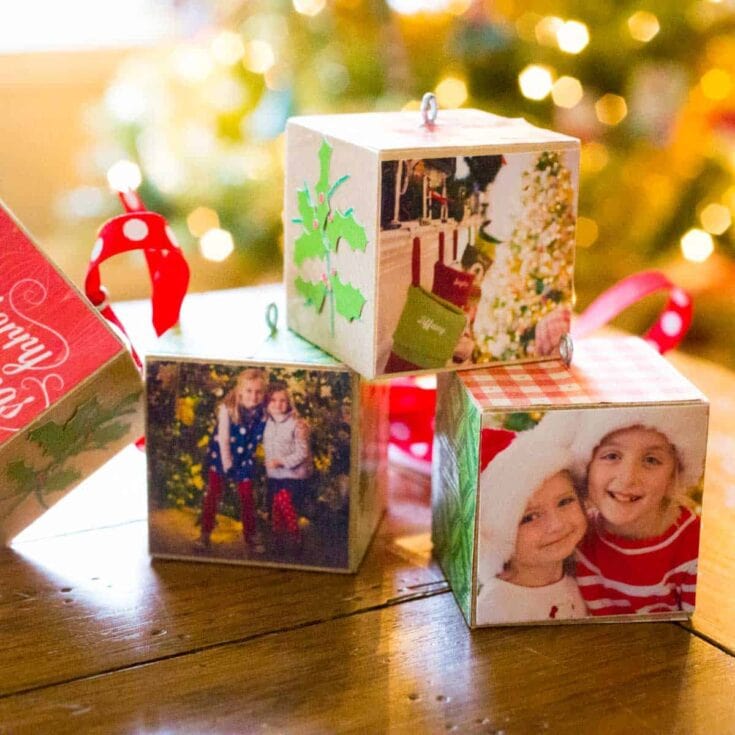 Decorative photo cubes with Christmas images and holiday themes, perfect for festive home decor and capturing holiday memories.