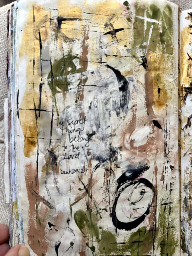 Abstract mixed media artwork featuring earthy tones, expressive brushstrokes, and a handwritten quote from the Bible, 'The secret things belong to the Lord'.