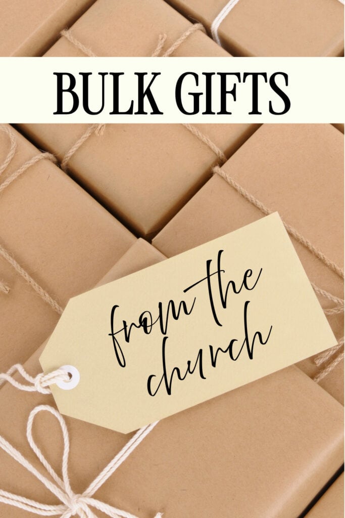 Large collection of wrapped bulk gifts with a tag that says 'from the church,' ideal for church gift-giving occasions.