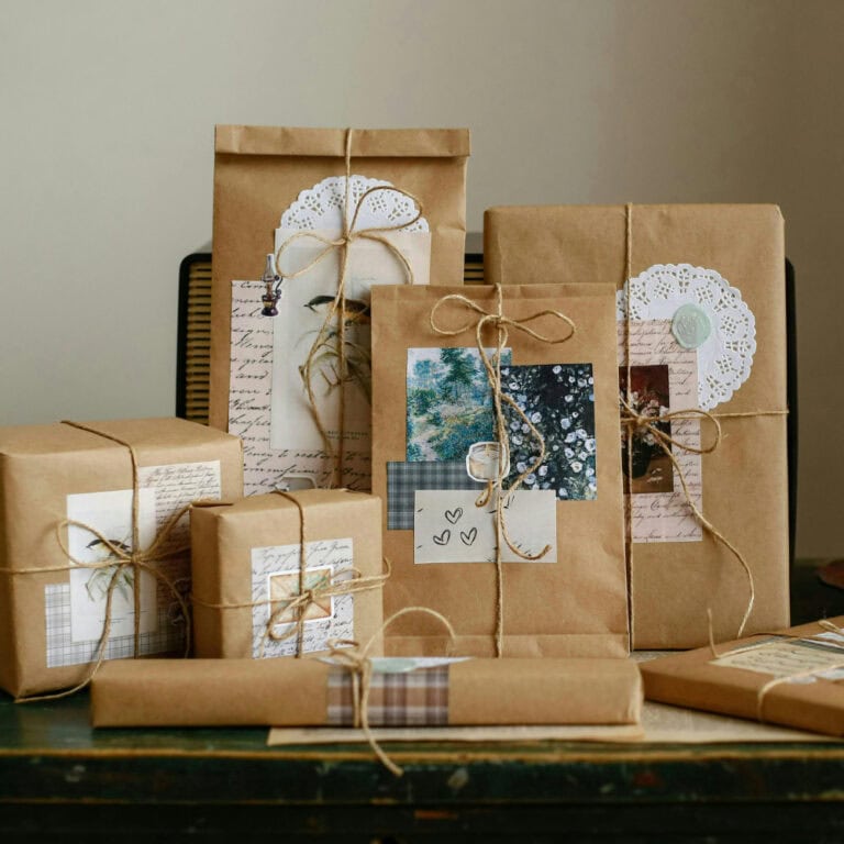 Various beautifully wrapped gifts with brown paper, twine, and decorative tags, perfect for Christian gift-giving occasions.